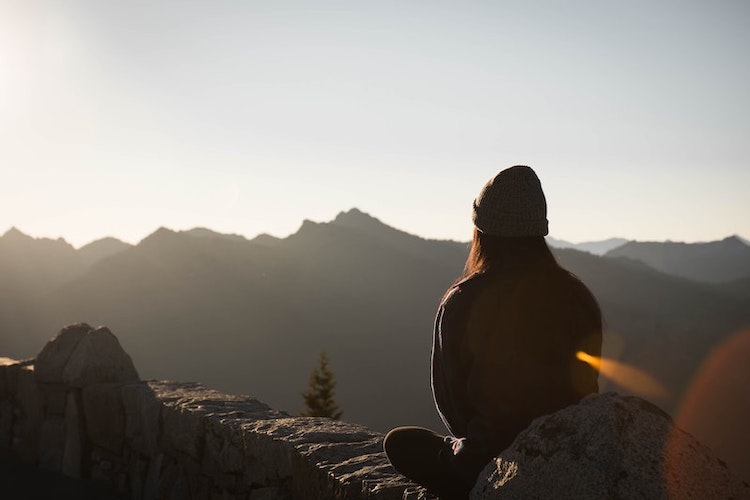 Girl meditation mountain sunset